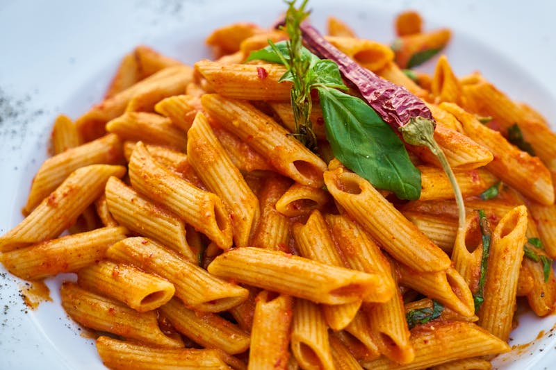Penne Arrabbiata with spicy tomato sauce and fresh basil
