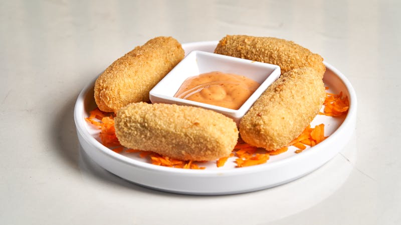 Crispy golden mozzarella sticks with marinara sauce