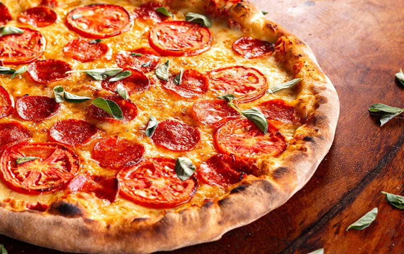 BBQ Chicken Crunch pizza with grilled chicken and smoky BBQ sauce